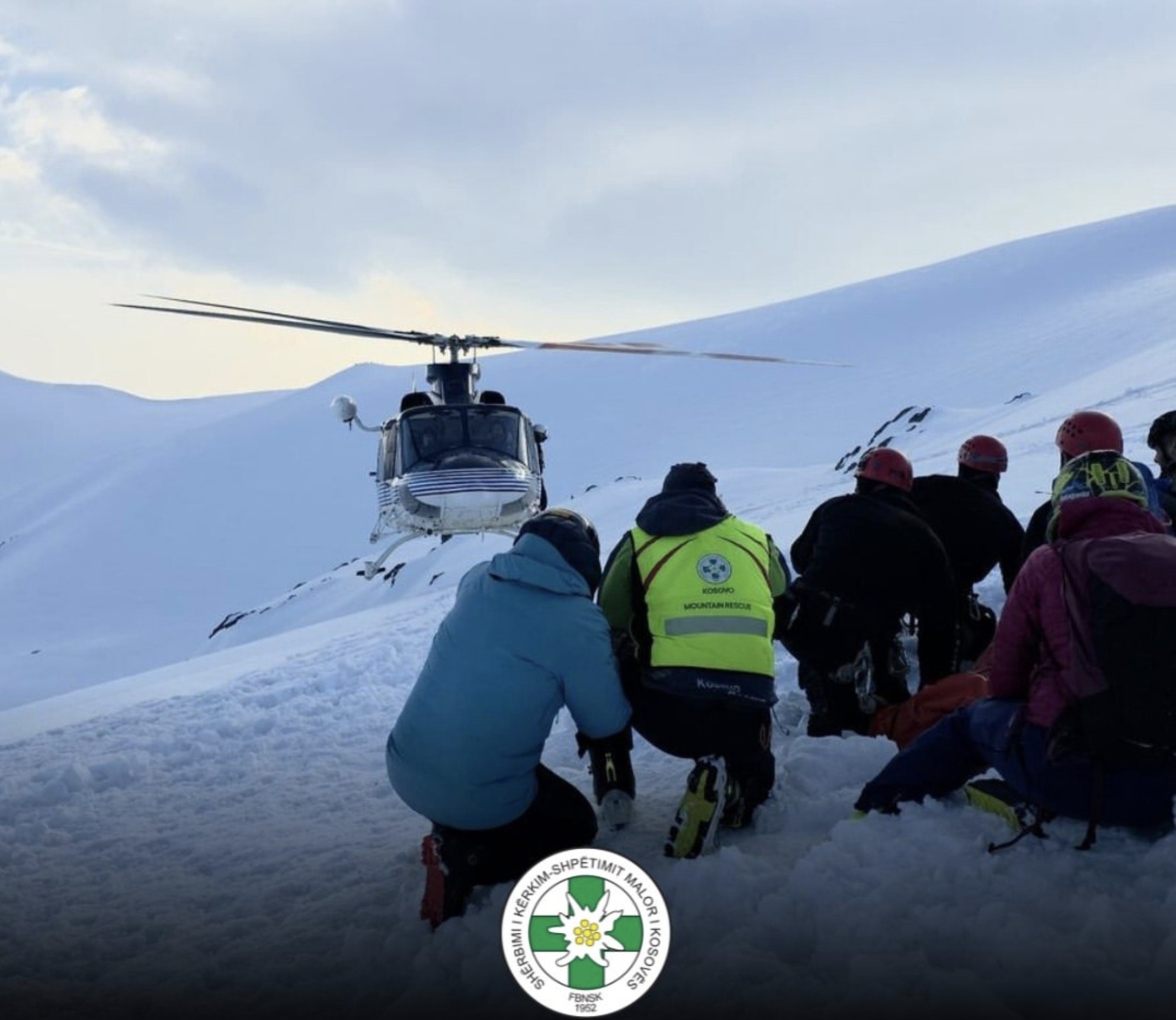 Mountain rescue team with a helicopter